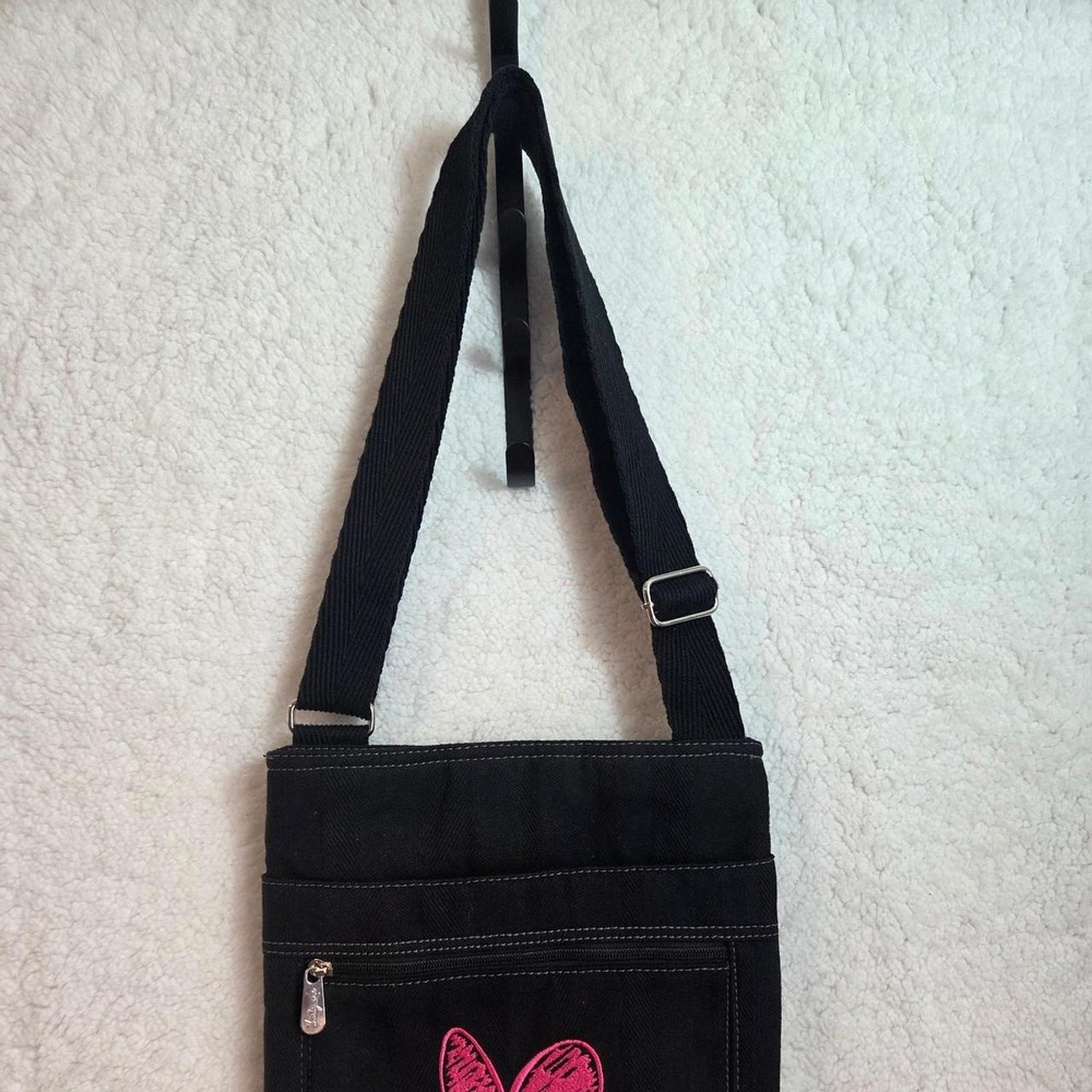 Black canvas crossbody purse.